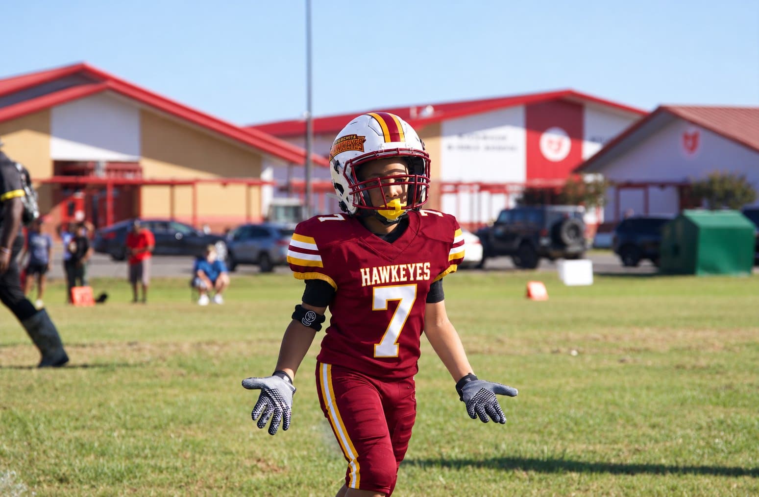 Ouachita Hawkeyes player #7 in the maroon home uniform
